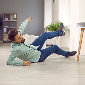 Man slipping and falling on a floor symbolizing slip and fall accident cases